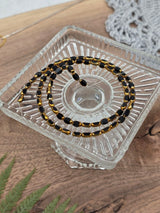 Metallic Glass Oval Beads – Black & Gold – 4 × 6 mm – 70 pcs