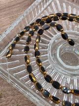 Metallic Glass Oval Beads – Black & Gold – 4 × 6 mm – 70 pcs