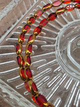 Metallic Glass Oval Beads – Ruby Red & Gold – 4 × 6 mm – 70 pcs